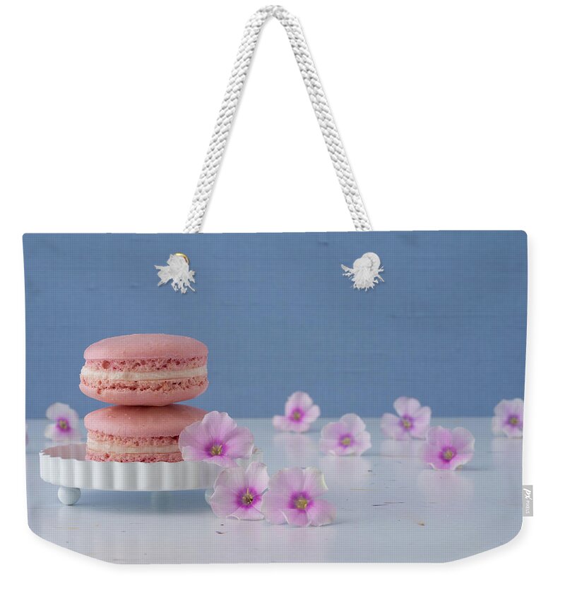 Macaron Weekender Tote Bag featuring the photograph Pretty Pink Macarons and Flowers by Tina Horne