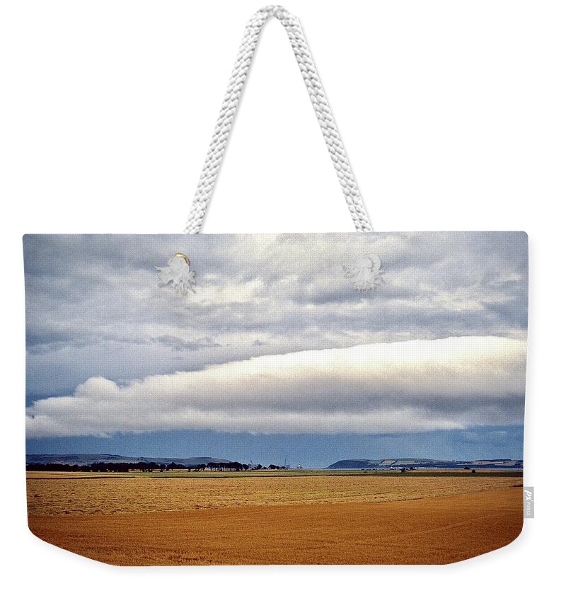  Weekender Tote Bag featuring the photograph Rain on the Horizon by Gordon James
