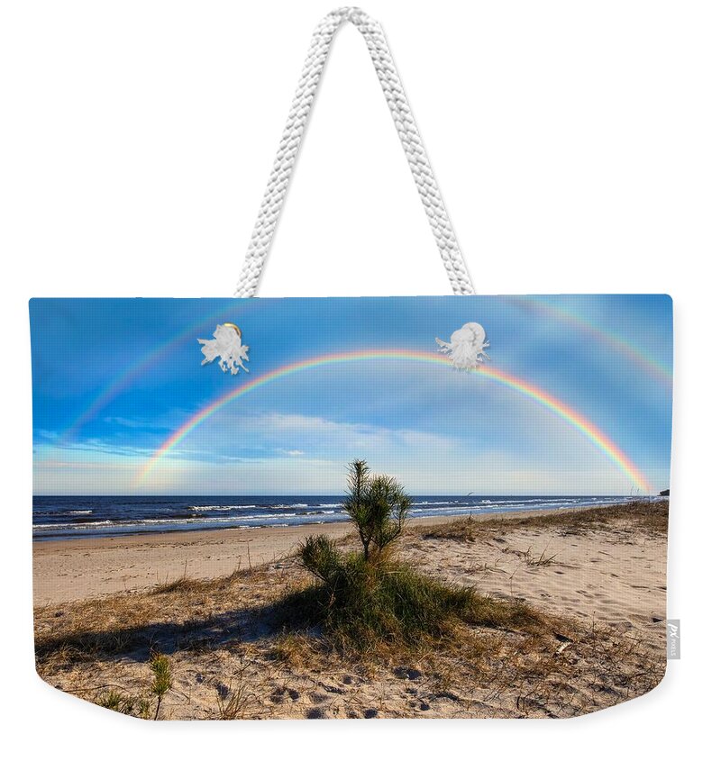 Little Pine Weekender Tote Bag featuring the photograph Rainbow And Little Pine On The Beach Jurmala / Elite Special Feature by Aleksandrs Drozdovs