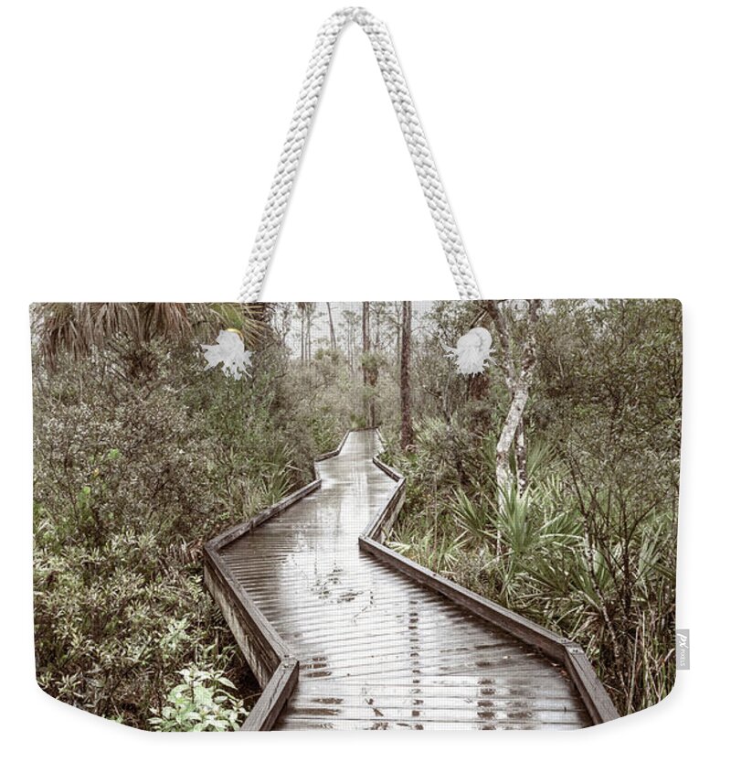 Clouds Weekender Tote Bag featuring the photograph Rainy Reflections on the Boardwalk Trail in Soft Tones by Debra and Dave Vanderlaan