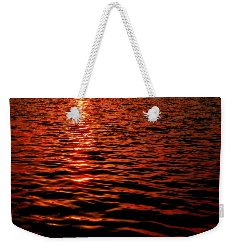 River Weekender Tote Bag featuring the photograph Red River at Sunset by Linda Stern