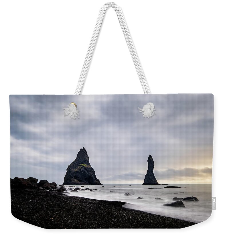 Reynisfjara Weekender Tote Bag featuring the photograph Reynisfjara black sand beach and Reynisdrangar in Iceland by Alexios Ntounas