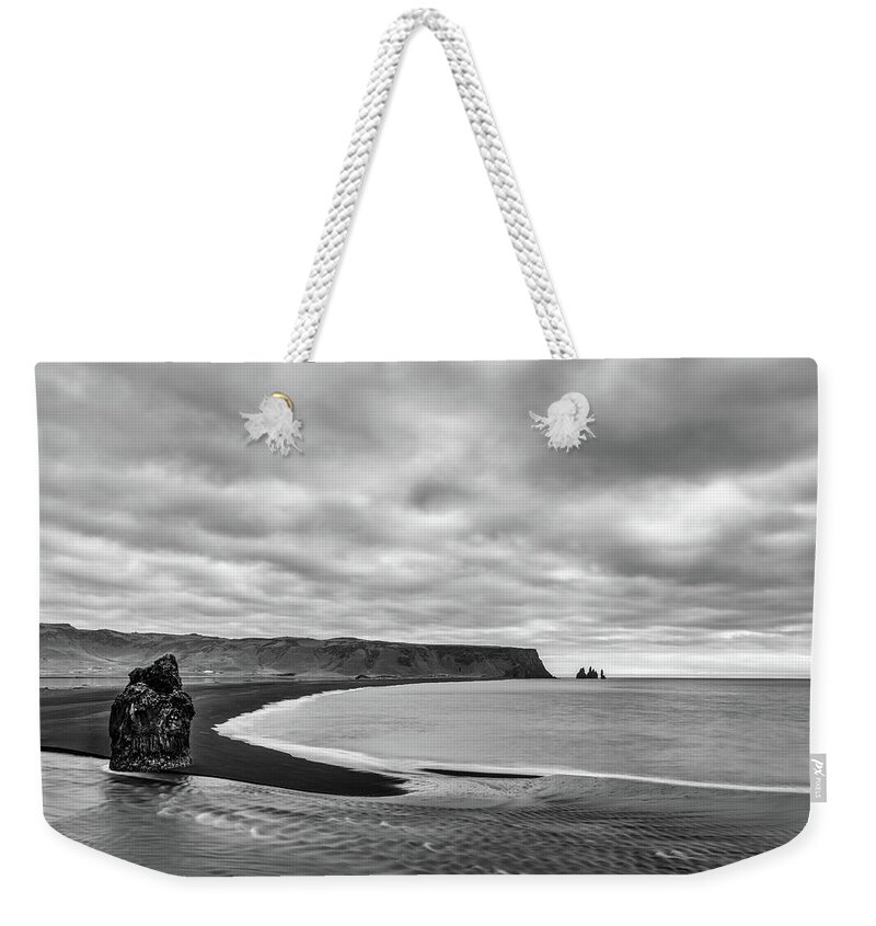 Reynisfjara Weekender Tote Bag featuring the photograph Reynisfjara Black Sand Beach in Iceland in Black and White by Alexios Ntounas