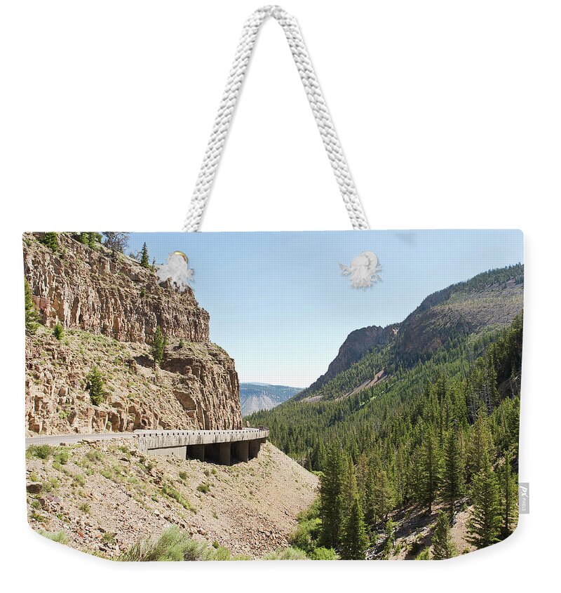 Montana Weekender Tote Bag featuring the photograph Roadway Throough Yellowstone National Park by Joe Granita