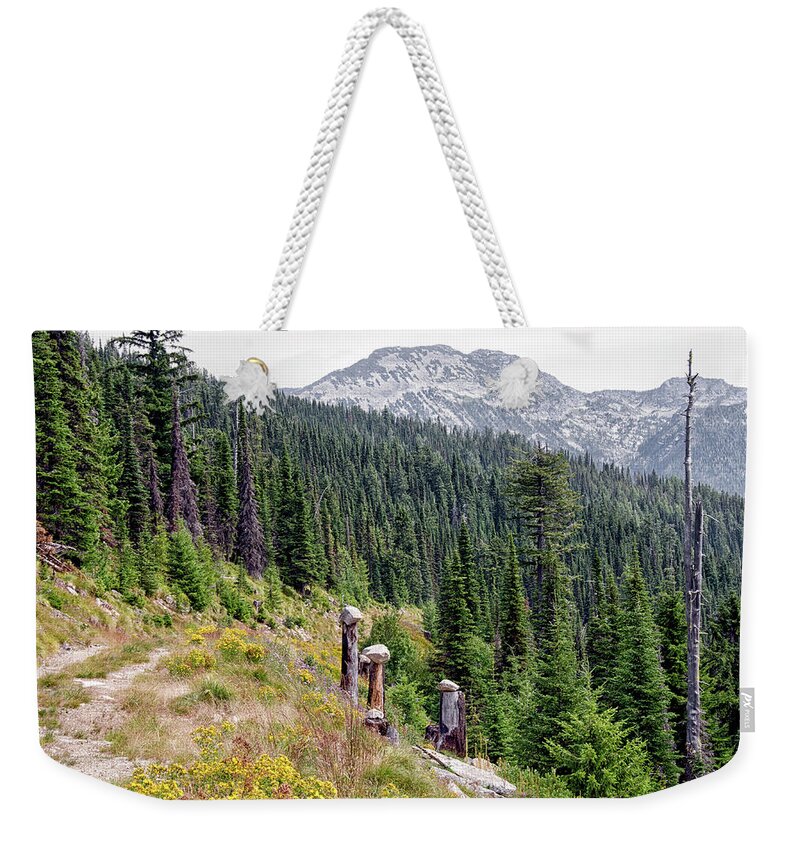 Landscape Weekender Tote Bag featuring the photograph Rock stacking by Debra Baldwin