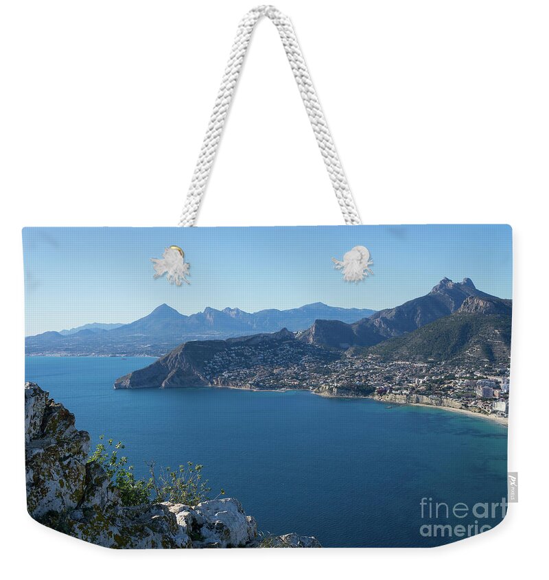 Mediterranean Sea Weekender Tote Bag featuring the photograph Rocks on the Mediterranean coast in Calpe by Adriana Mueller
