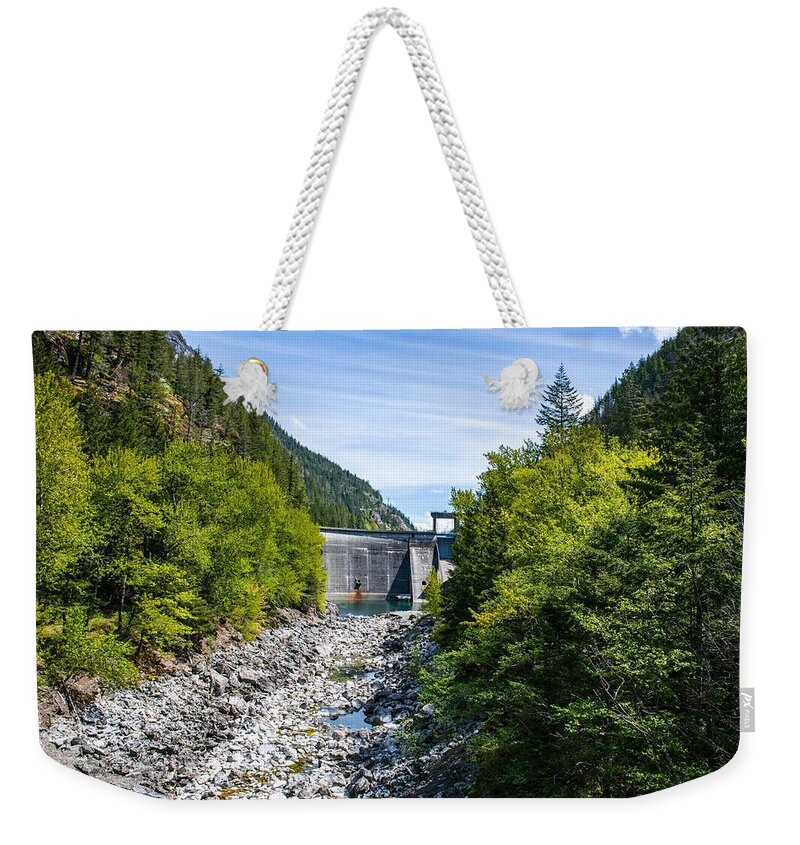 Rocky Skagit River Bed And Gorge Dam Weekender Tote Bag featuring the photograph Rocky Skagit River Bed and Gorge Dam by Tom Cochran