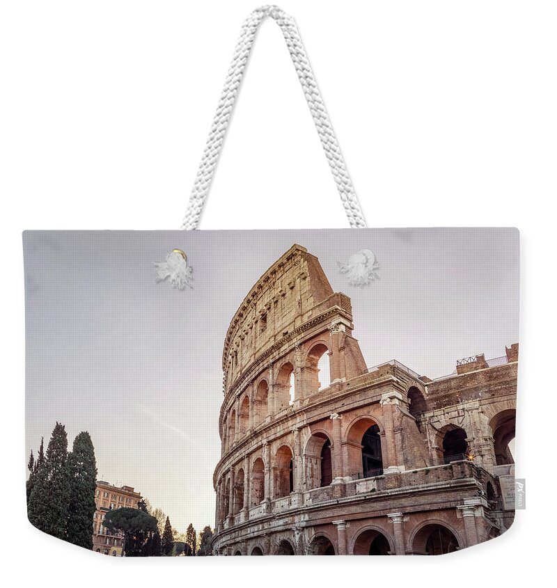 Capital Weekender Tote Bag featuring the photograph Rome and The Coliseum at sunrise by Benoit Bruchez