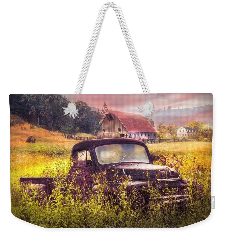 American Weekender Tote Bag featuring the photograph Rusty Truck Deep in the Wildflowers in Autumn Light by Debra and Dave Vanderlaan