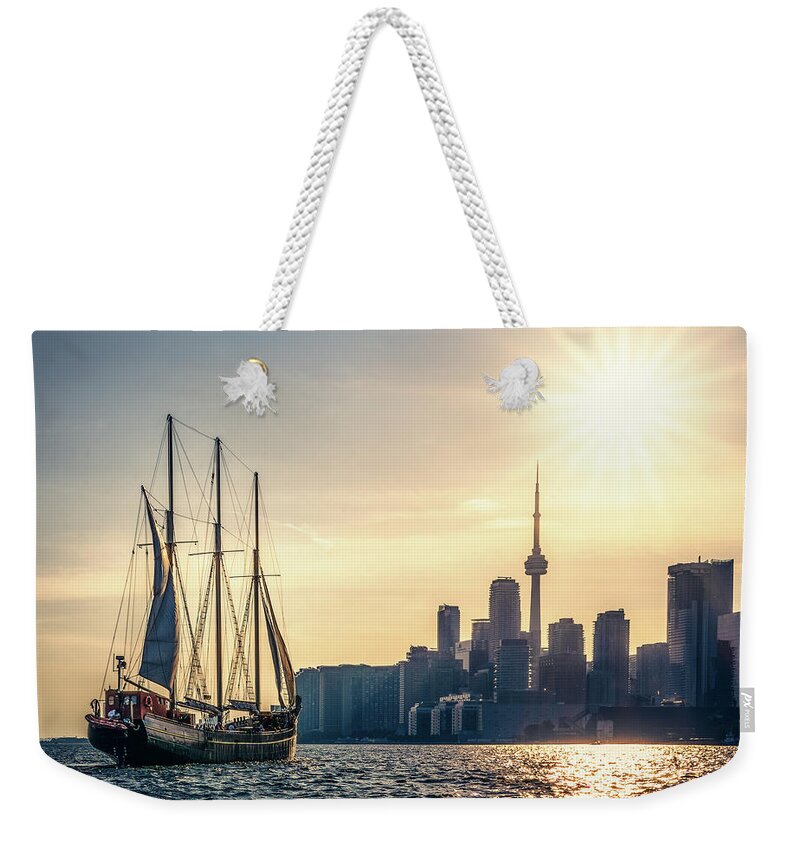 Cn Tower Weekender Tote Bag featuring the photograph Sailing the Sun by Dee Potter