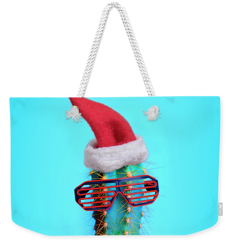 Cactus Weekender Tote Bag featuring the photograph Santa cactus. Funky pop art minimal christmas in summer concept. by Jelena Jovanovic