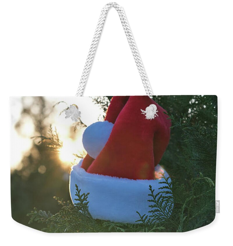 Holiday Weekender Tote Bag featuring the photograph Santa Hat by Andrea Anderegg