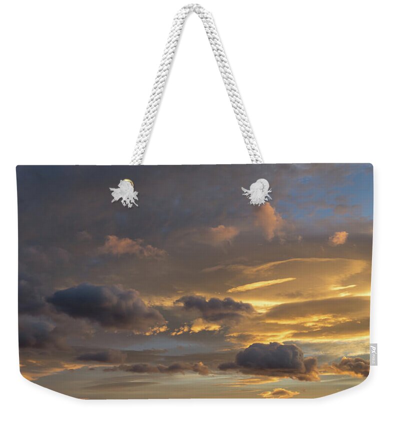 Clouds Weekender Tote Bag featuring the photograph Scenic sunset sky in Calpe by Adriana Mueller