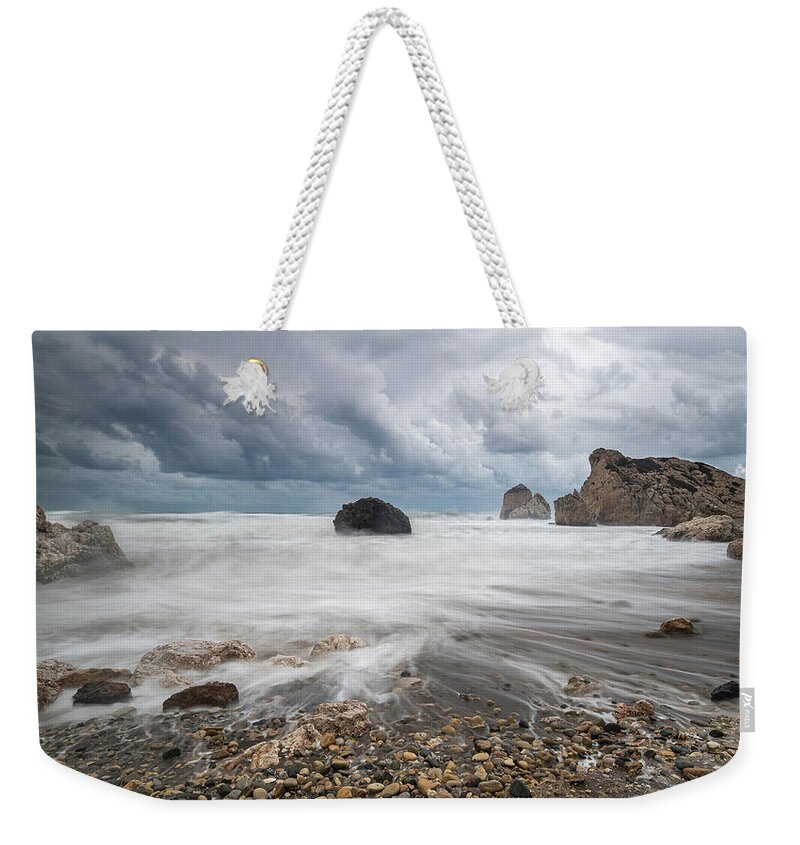 Seascape Weekender Tote Bag featuring the photograph Seascape with windy waves during storm weather at the a rocky co by Michalakis Ppalis