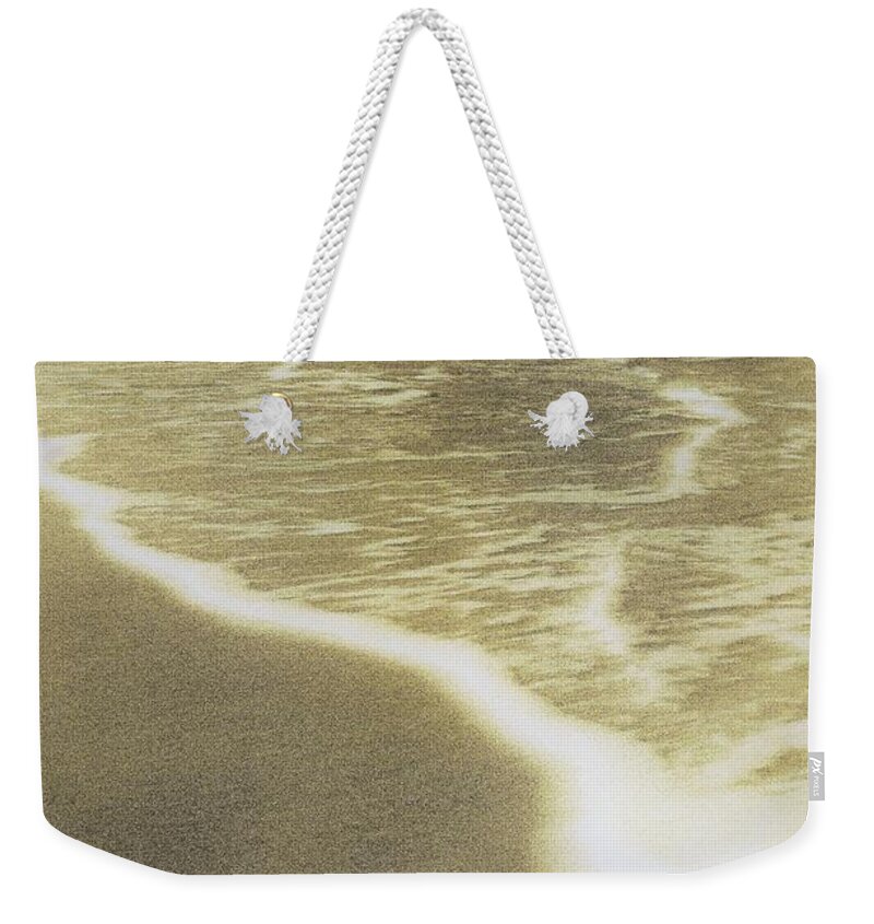 Sepia Weekender Tote Bag featuring the photograph Sepia shell and foam by Michael McCormack