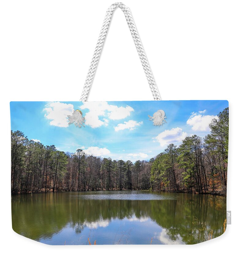 Lake Weekender Tote Bag featuring the photograph Silky Clouds Over Blue Sky at Sibley Pond by Marcus Jones
