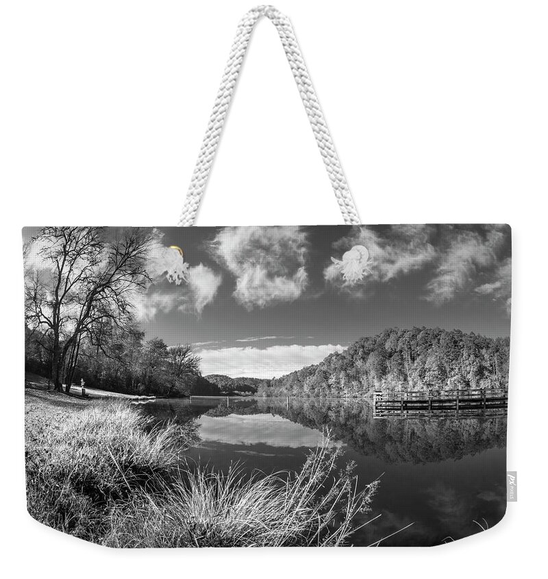 Carolina Weekender Tote Bag featuring the photograph Silver Grasses at the Docks Black and White by Debra and Dave Vanderlaan