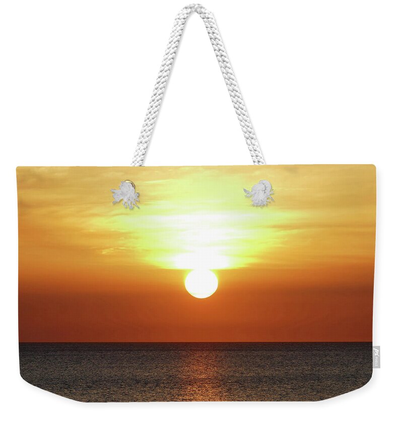 Sunset Weekender Tote Bag featuring the photograph Sinking sun by Maryse Jansen