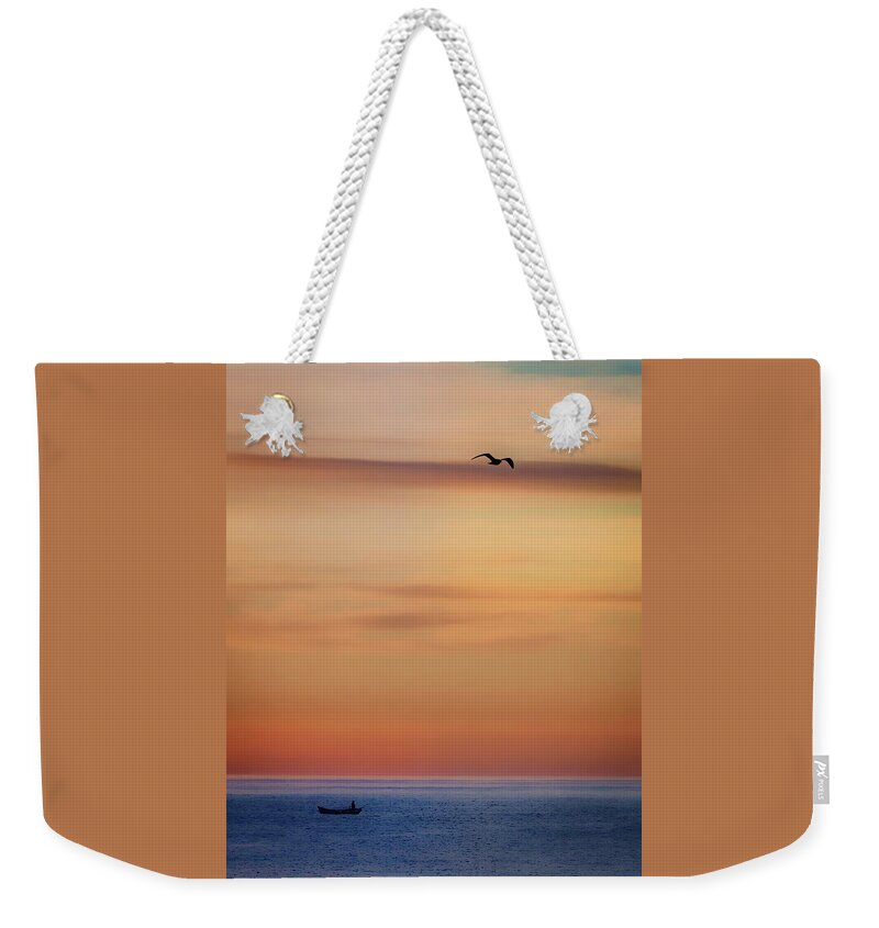 Photographs Weekender Tote Bag featuring the photograph Skittle and Gull at Sunrise by John A Rodriguez