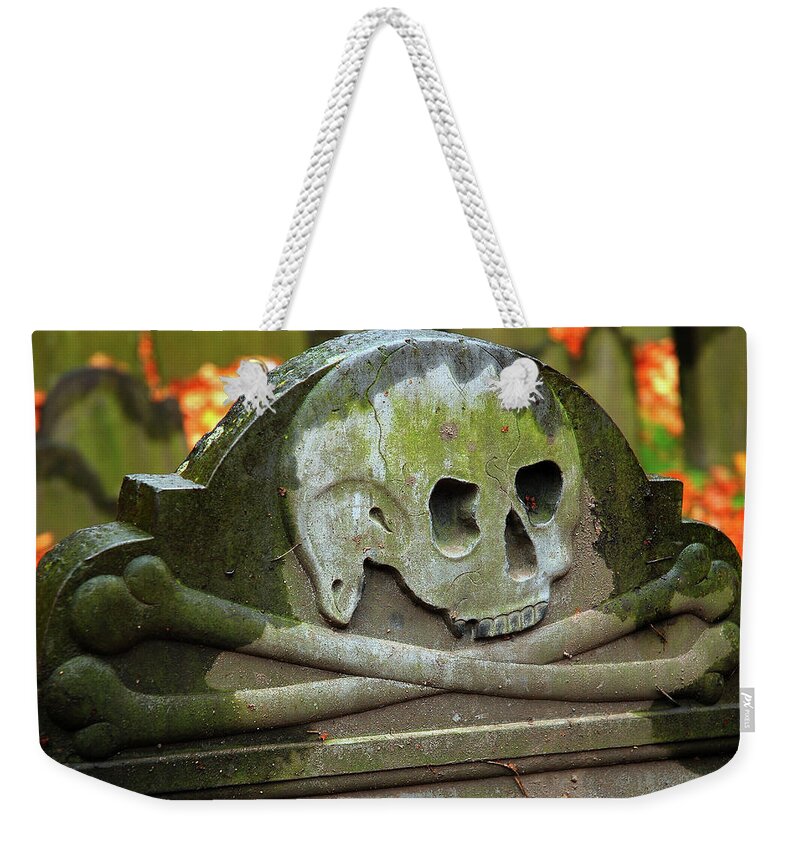 Boston Weekender Tote Bag featuring the photograph Skull and Cross bones grave by James Kirkikis