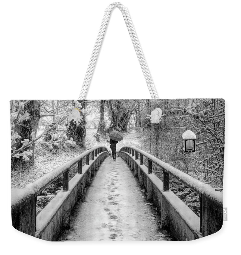 Bridge Weekender Tote Bag featuring the photograph Snowy Walk in Black and White by Debra and Dave Vanderlaan