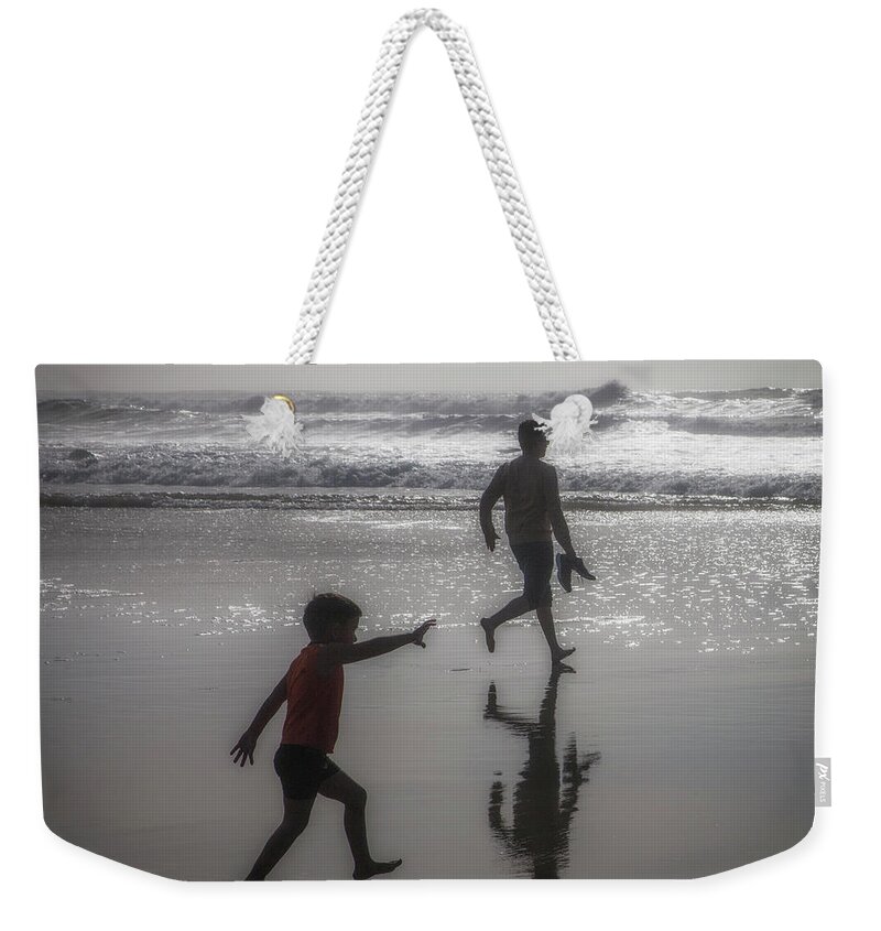 Son And Dad Weekender Tote Bag featuring the photograph Son and dad, Ocean Beach by Donald Kinney