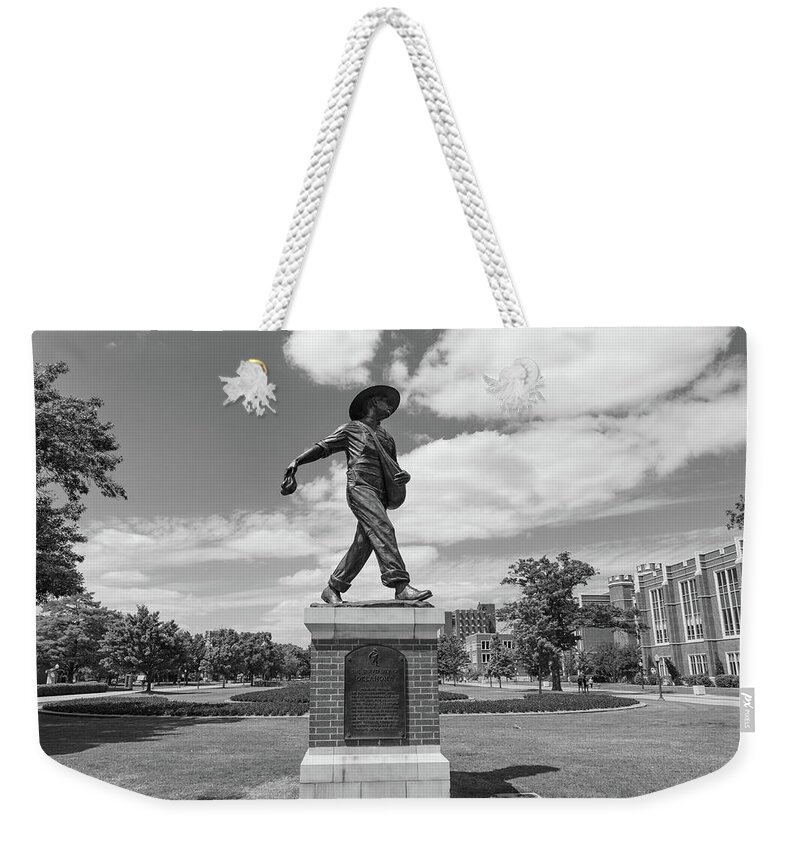 Big 12 Weekender Tote Bag featuring the photograph Sower Statue on the campus of the University of Oklahoma in black and white by Eldon McGraw