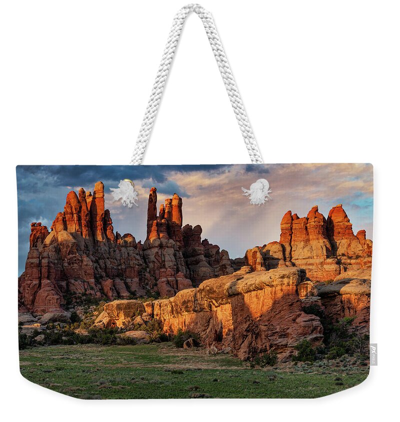 Desert Weekender Tote Bag featuring the photograph Spires at Devil's Kitchen by Dan Norris