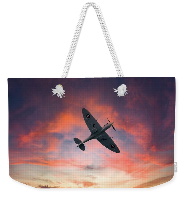 Eastbourne International Airshow Weekender Tote Bag featuring the photograph Spitfire flying at sunset by Andrew Lalchan