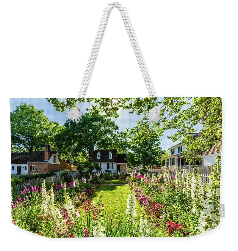 Colonial Williamsburg Weekender Tote Bag featuring the photograph Spring Flowers in May at the Taliaferro-Cole Garden by Rachel Morrison