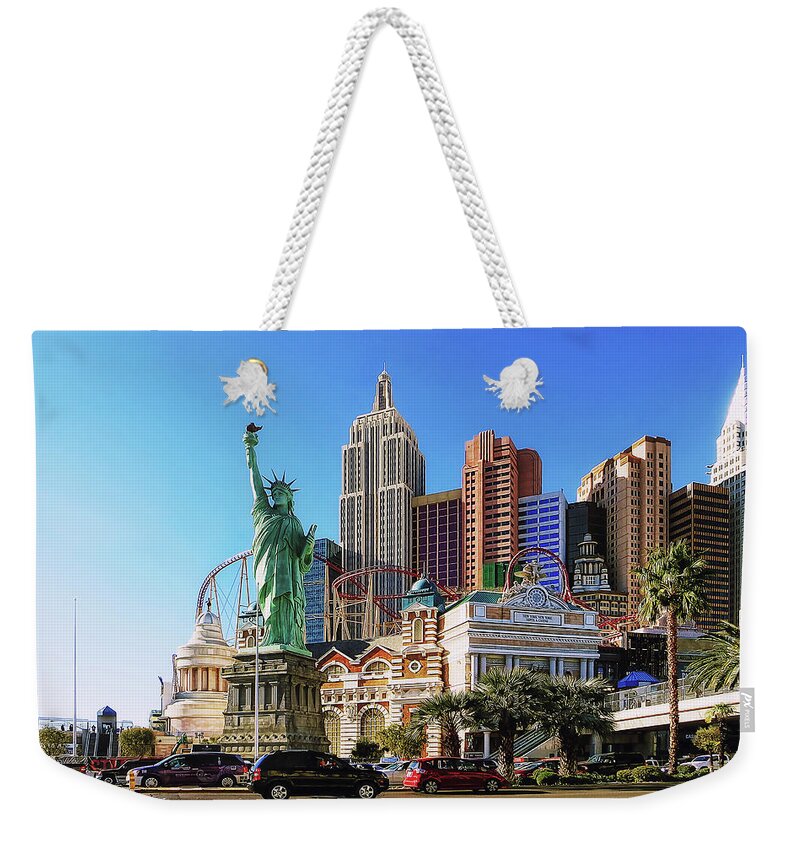 New York Las Vegas Weekender Tote Bag featuring the photograph Statue of Liberty and NY Complex, Las Vegas by Tatiana Travelways