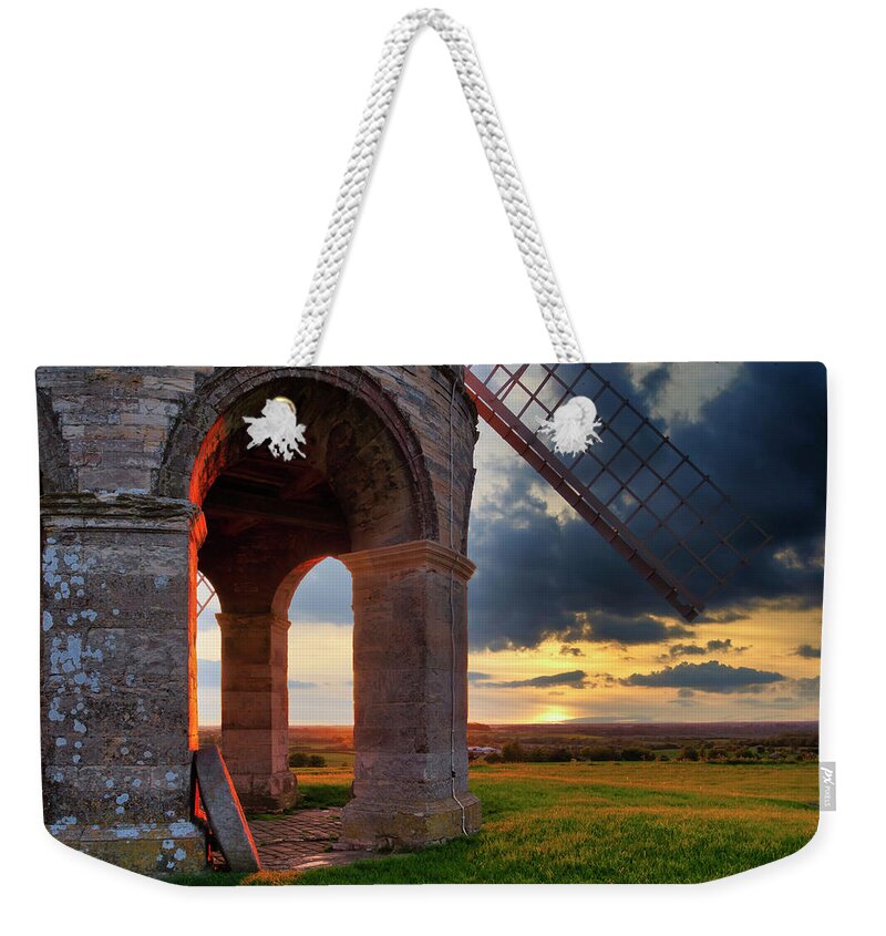 Landscape Weekender Tote Bag featuring the photograph Stone windmill by Remigiusz MARCZAK