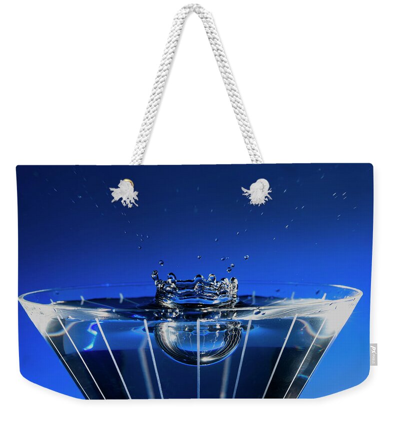 North Wilkesboro Weekender Tote Bag featuring the photograph Stop Motion Martini Glass Blue Splash by Charles Floyd