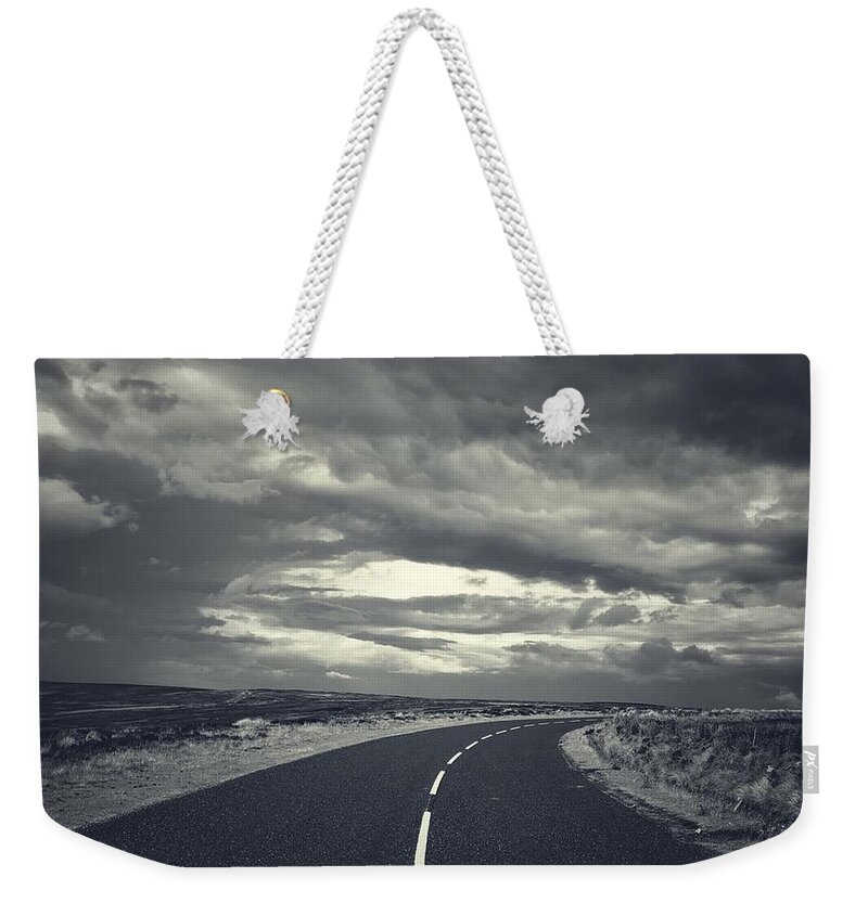 Stormy Skies Weekender Tote Bag featuring the photograph Storm over the Moors by Mark Egerton