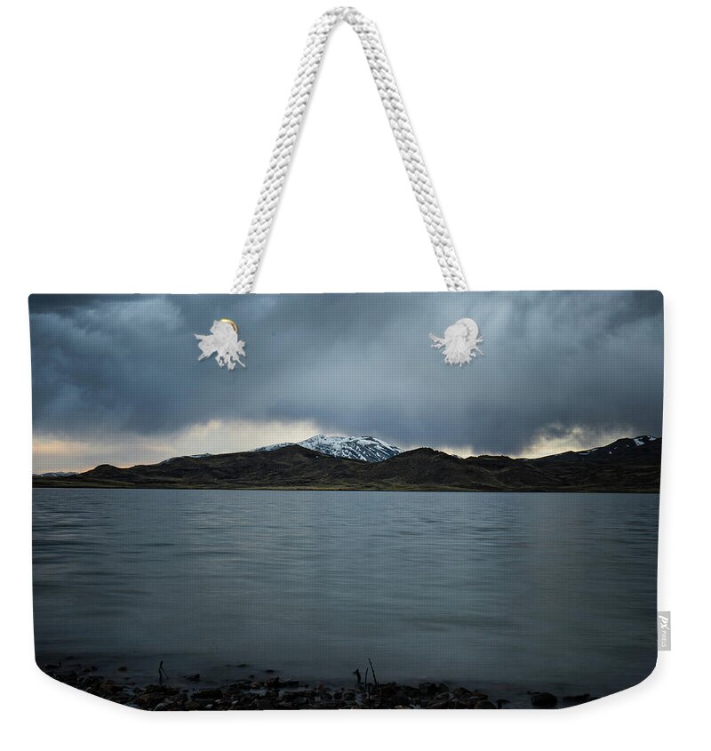 Mountains Weekender Tote Bag featuring the photograph Storm Over Wildhorse by Ron Long Ltd Photography