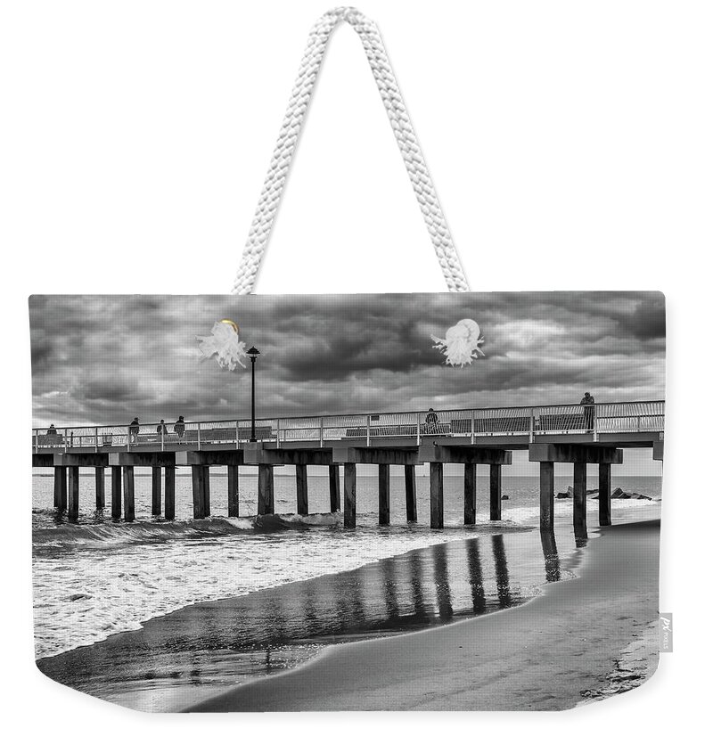 Coney Island Weekender Tote Bag featuring the photograph Stormy Reflections by Cate Franklyn
