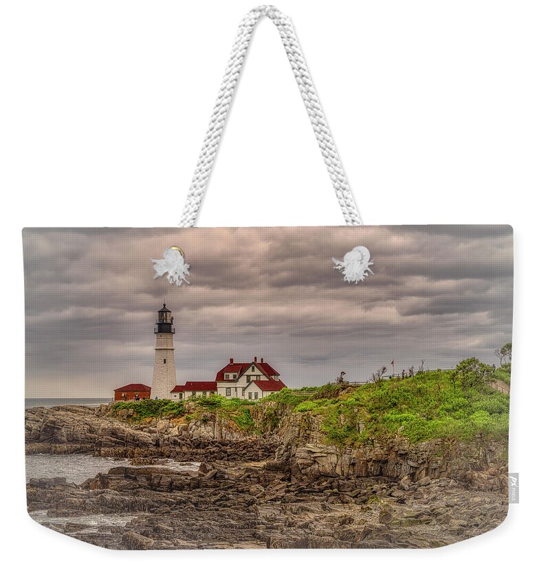 Portland Head Light Weekender Tote Bag featuring the photograph Stormy Skies at Portland Head Light by Penny Polakoff