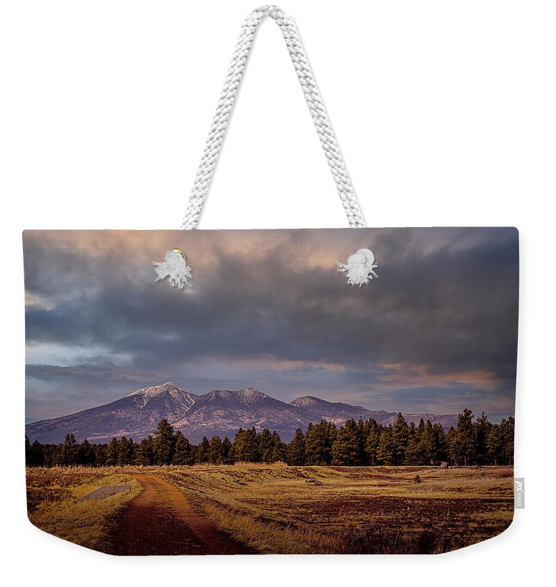 Wetlands Weekender Tote Bag featuring the photograph Stormy Skies by Laura Putman