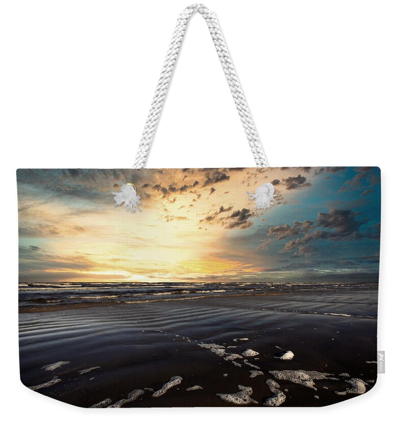 After Storm Follows Calm Weekender Tote Bag featuring the photograph Stormy Spirit During Sunset Time On The Beach Jurmala Latvia by Aleksandrs Drozdovs