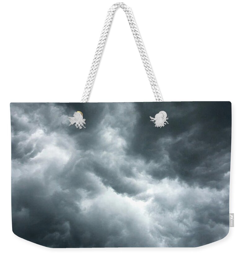 Clouds Weekender Tote Bag featuring the photograph Stormy clouds in the sky. by Bernhard Schaffer