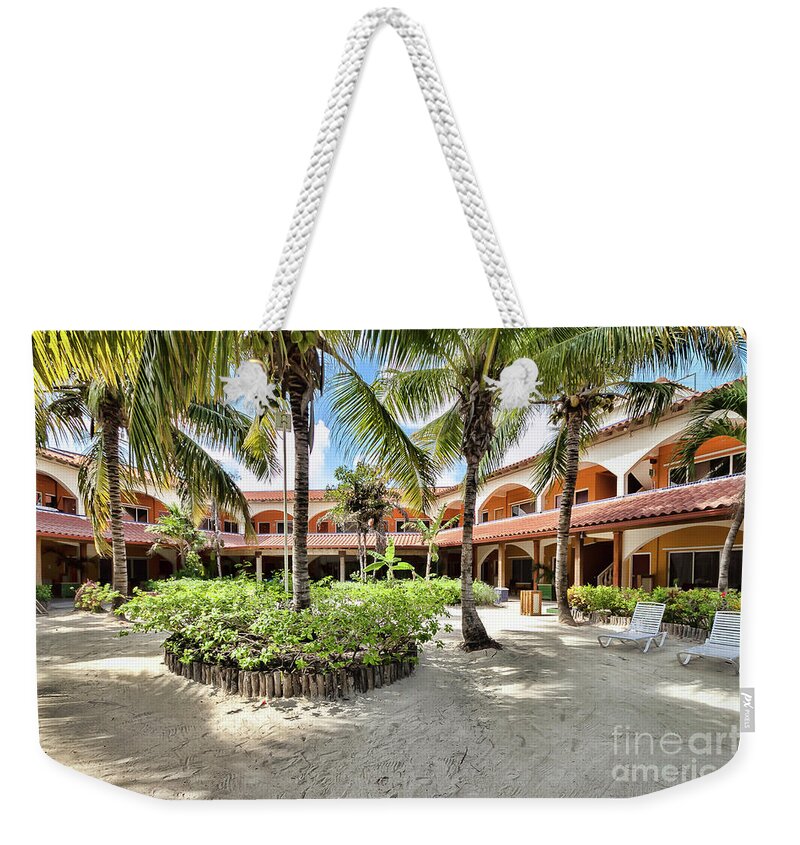 Ambergris Caye Weekender Tote Bag featuring the photograph Sun Breeze Hotel by Lawrence Burry