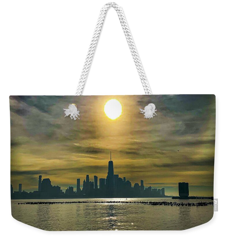 Freedom Tower Weekender Tote Bag featuring the photograph Sun over the city by Jim Feldman