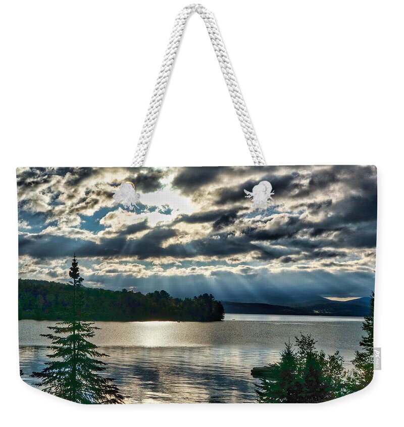 Sun Weekender Tote Bag featuring the photograph Sun Rays and Storm Clouds Over Rangeley Maine by Russel Considine