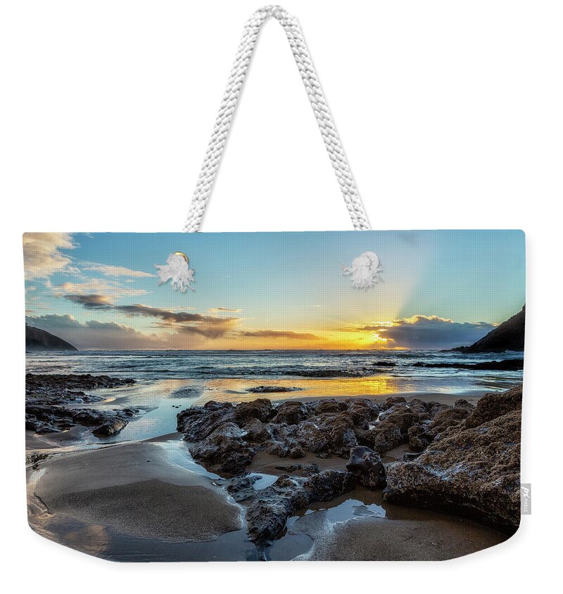 Sunset Weekender Tote Bag featuring the photograph Sun Setting at the Heceta Head Lighthouse Beach by Belinda Greb