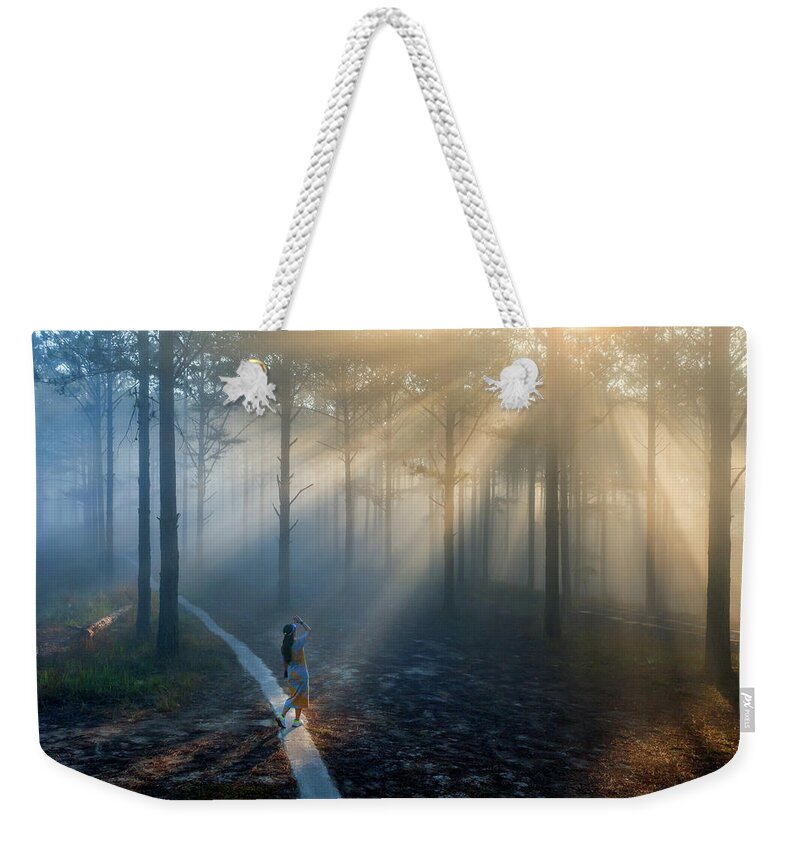 Awesome Weekender Tote Bag featuring the photograph Sunrays in the pine forest by Khanh Bui Phu
