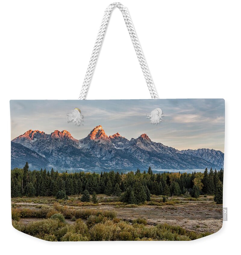 Sunrise Weekender Tote Bag featuring the photograph Sunrise over the Grand Tetons from Blacktail Ponds Overlook, No. 1 by Belinda Greb