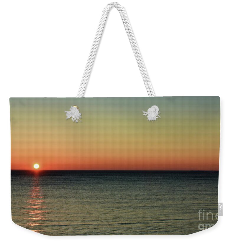 Sunrise Weekender Tote Bag featuring the photograph Sunrise over the sea by Yavor Mihaylov