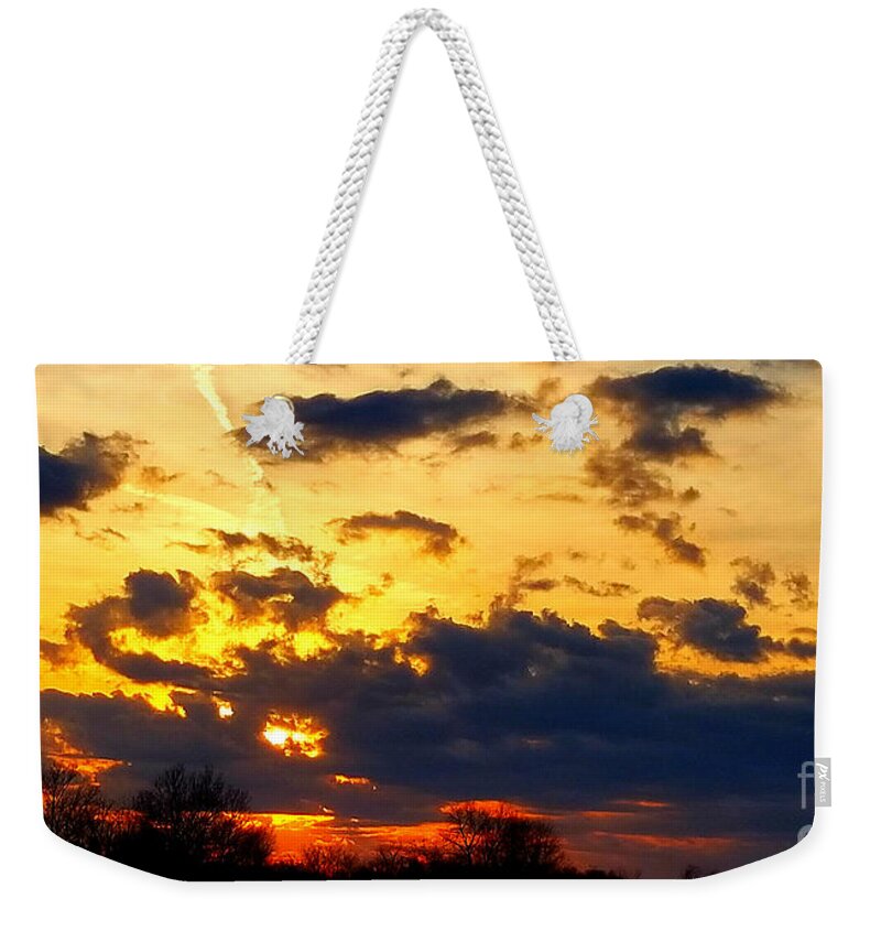 Cloud Weekender Tote Bag featuring the photograph Sunset Ablaze by Tina Mitchell