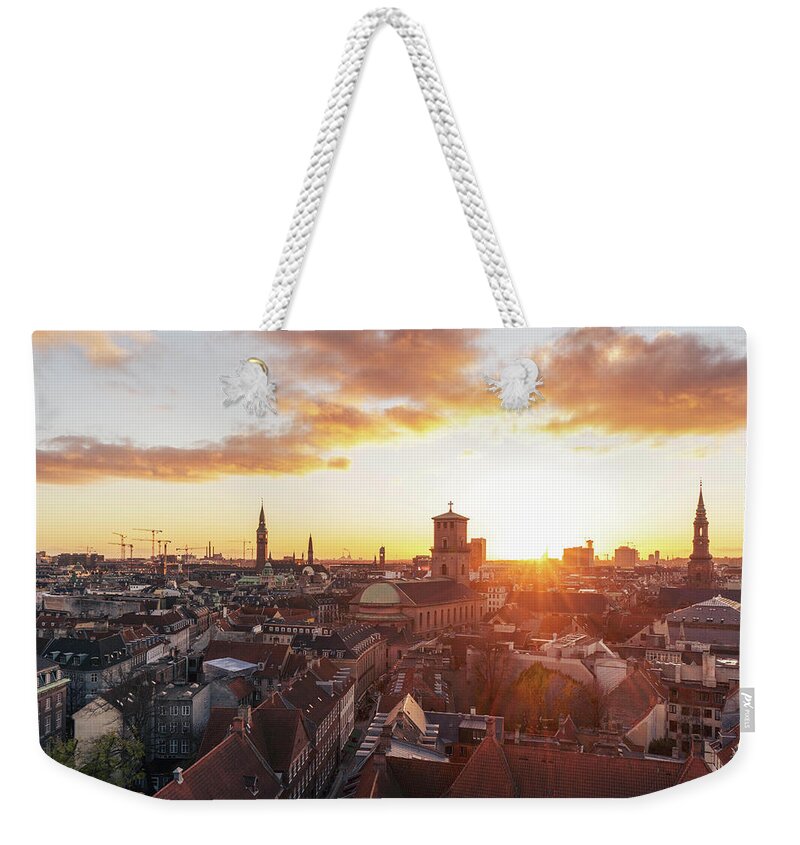 City Weekender Tote Bag featuring the photograph Sunset above Copenhagen by Hannes Roeckel
