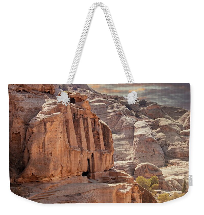 Petra Weekender Tote Bag featuring the photograph Sunset at the lost city of Petra, Jordan. Amazing buildings are carved out of the pink rock and the Rose City dates to around 300 BC by Jane Rix